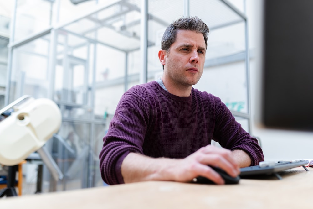 an engineer looking at data on a computer.