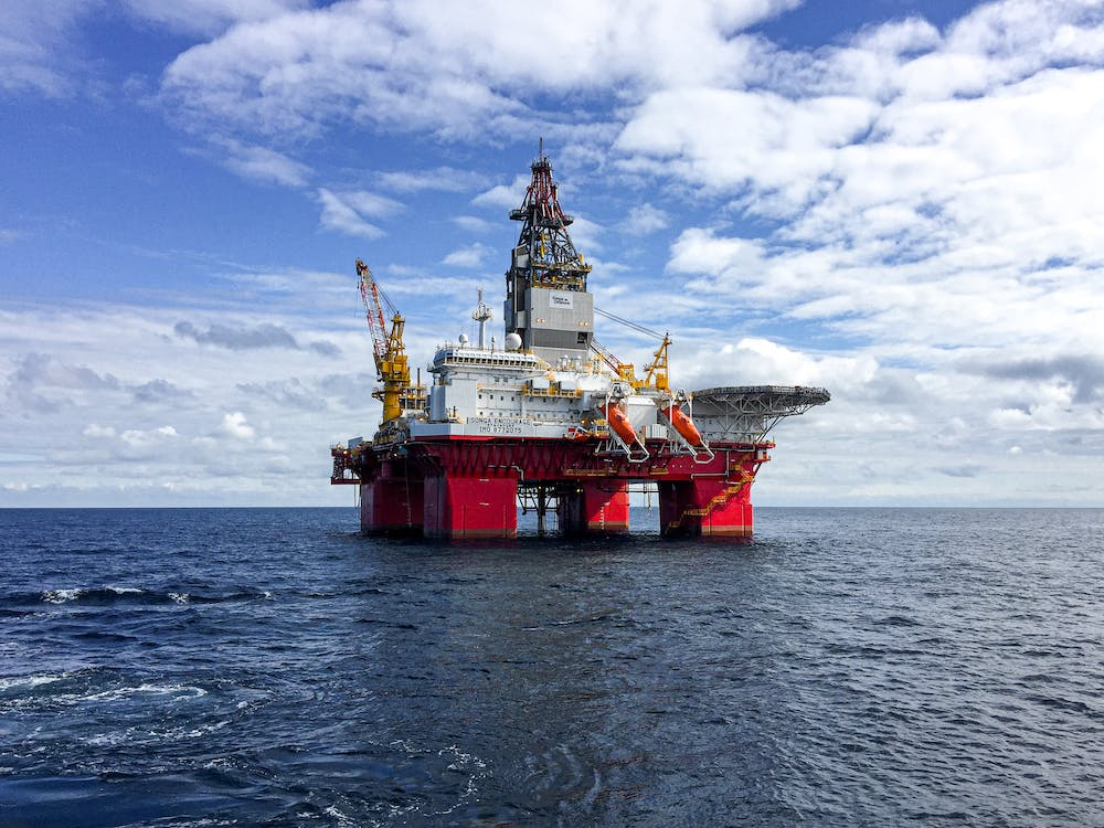 An oil and gas rig in the middle of a water body